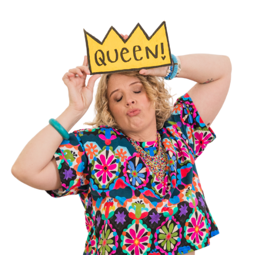 Leonie holding a “Queen!” crown sign